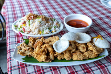 Popular Filipino Food - Calamares and Fried rice at Restaurant