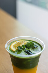 a cup of fresh green tea with lemon and mint