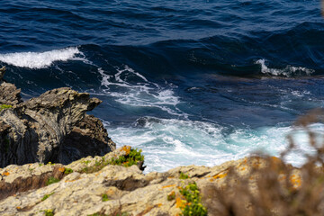 breaking wave against the rocks