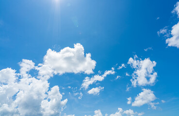 Blue sky and white clouds with sunlight on sunny day. World ozone day concept. Blue sky background for international day for the preservation of the ozone layer. Cloudscape. Hot weather in summer.