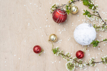 Christmas decorations and a branch with a flower