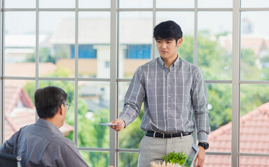 Asian businessman anti bribery and corruption he rejecting money in white envelope offered by...