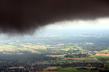 Dark, stormy clouds over Poland. View from the plane, polish landscape and dark clouds
