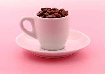 White cup with coffee beans