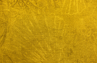 Fototapeta Golden wall with abstract spots as a background. Beautiful golden texture with patterns, decorative plaster. Modern bright wall painting in trendy shades, unusual spotted yellow and gold surface. obraz