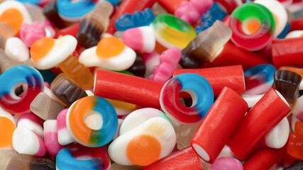 Tasty mix of jelly colorful candies isolated on a white background.