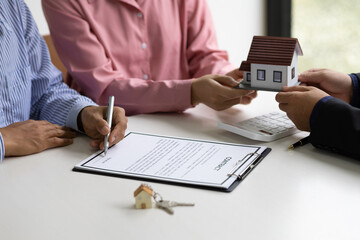Real estate agents offer homes to customers and sign contracts for legal home purchases.