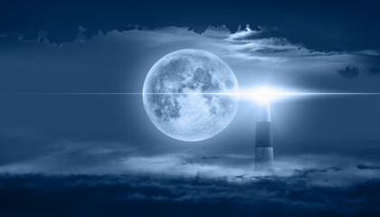 Night sky with super full moon in the clouds, on the foreground lighthouse "Elements of this image furnished by NASA"