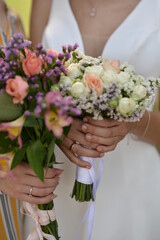Two girls hold beautiful bouquets, brides with flowers