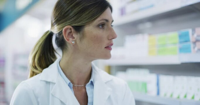 Pharmacist taking product stock on shelf for medicine service, pharmaceutical pills and medical clinic check. Healthcare manager, pharmacy woman and drugstore worker writing retail inventory notes