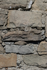 Handmade wall texture with stones and cement, Appennini, Italy