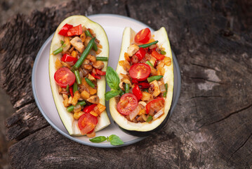 appetizing eggplant stuffed with mushrooms, tomato, asparagus and onion
