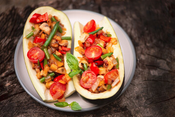 appetizing eggplant stuffed with mushrooms, tomato, asparagus and onion