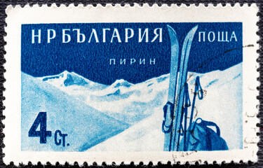 Bulgaria 1958 July 5: An blue 4 stotinka postage stamp showing Skis and Pirin Mountains. Bulgarian Health Resorts.