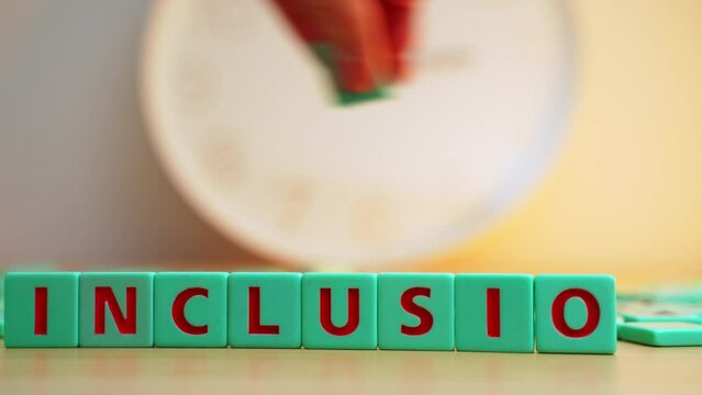 The word INCLUSION made of colorful scrabble tiles. Every young person, regardless of their sexual orientation or gender identity, deserves equal access to opportunities and services and their safety