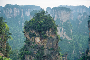 Fototapeta premium Alone rock column mountain (Avatar rocks). Zhangjiajie National Forest Park was officially recognized as a UNESCO World Heritage Site - China