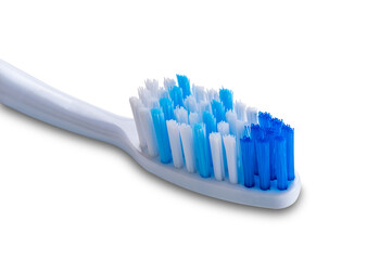 Closeup of blue soft tooth brush isolated on white background with clipping path.