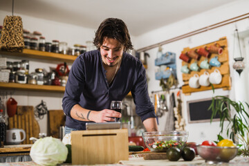 Fototapeta na wymiar young adult man preparing food in his home kitchen