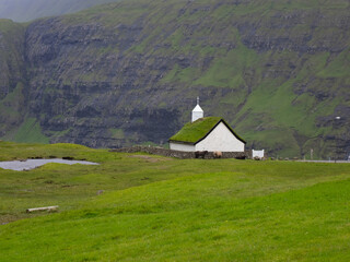 Surreally beautiful Saksun village on the northwest coast of Streymoy Island, Faroe Islands (Faroes, Føroya, Færøerne) a North Atlantic archipelago part of the Kingdom of Denmark.