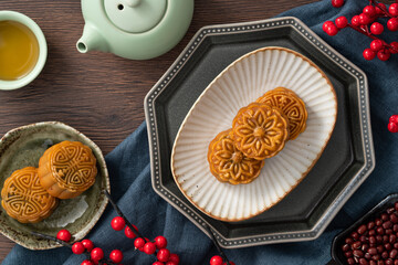 Delicious Cantonese moon cake for Mid-Autumn Festival food mooncake on wooden table background.