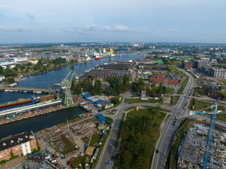 Cranes in Gdansk Shipyard Aerial View. Motlawa River Industrial Part of the City Gdansk, Poland. Europe.  - obrazy, fototapety, plakaty