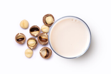 Macadamia milk with macadamia nuts isolated on white background. Top view. Flat lay. 