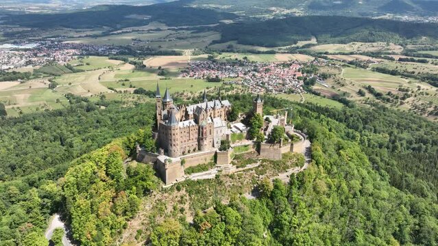 Burg Hohenzollern castle between Hechingen and Bisingen Germany, was the medieval castle of the Hohenzollern family. Stronghold fortress culturale heritage. Aerial drone overhead view in summer.