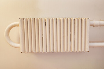 Old heating radiator in the house. Battery for room heating.