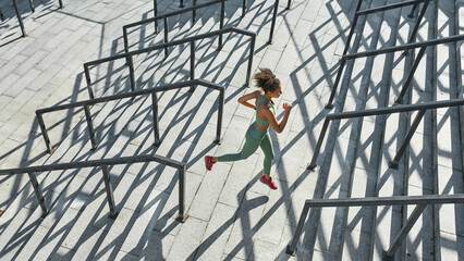 Young black sportswoman run or jog on staircase