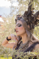 Gentle portrait of a girl in the image of a light elf with beautiful makeup
