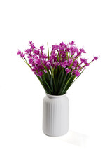 Close-up shot of a bouquet of realistic artificial orchids in a white vase. The vase of purple flowers is isolated on a white background. Front view.