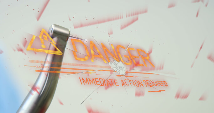 Image of danger text over dental drill