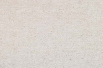 Craft paper texture, a sheet of beige recycled cardboard texture as background
