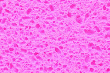 Purple porous cleaning sponge texture or background

