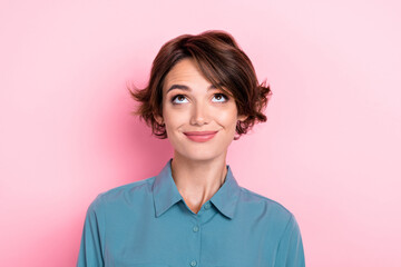 Portrait of pretty gorgeous optimistic girl with bob hairstyle dressed blue blouse look empty space...