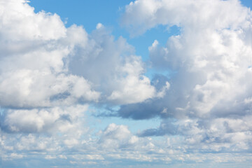 Naklejka na ściany i meble White clouds against the blue sky. The background image.