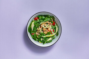 Warm salad with seafood.