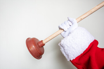 Santa's hands using a toilet plunger