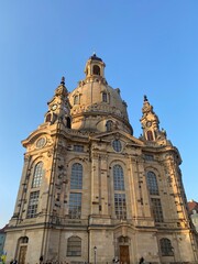 Fototapeta na wymiar Dresden, Germany: Panoramic view of historical center, Church of our Lady (Frauenkirche) and Neumarkt square in downtown of Dresden in summer with blue sky