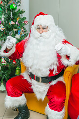 Christmas holiday portrait of authentic Santa Claus in red costume. Xmas scene. Merry Christmas and Happy Holidays !