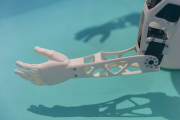 Fragment of a robot arm close-up under artificial lighting.