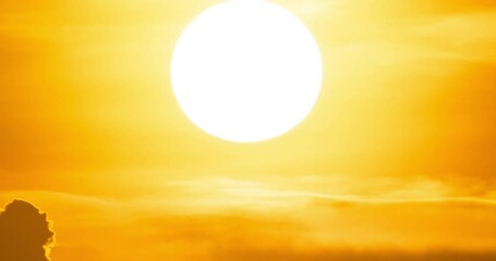 Sunset time-lapse video beautiful in nature 4K 4096x2160p ProRes 4:2:2 HQ Amazing Telephoto lens Closeup the sun in sunset Time lapse video nature and travel concept.