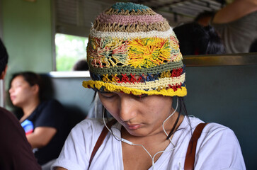 Asian thai women travelers people sit listen music and sleep dream on locomotive train after travel visit phra nakhon si ayutthaya between railway railroad running from Ayutthaya to Bangkok, Thailand