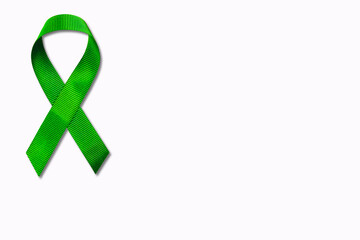 Green ribbon isolated on white background.