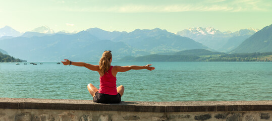 woman enjoying panoramic view of geneva lake and alps mountain