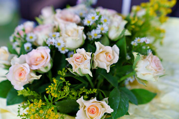 bouquet of pink roses and daisies. delicate and beautiful bouquet.
