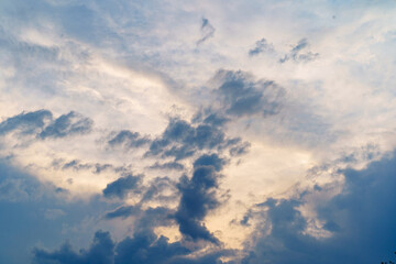 evening overcast sky. the rays of the sun make their way through the clouds.