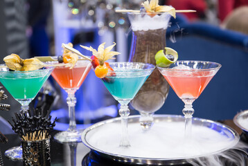 Cocktails with various alcoholic drinks at the bar.