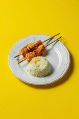 Rice with corn and salmon shish kebab