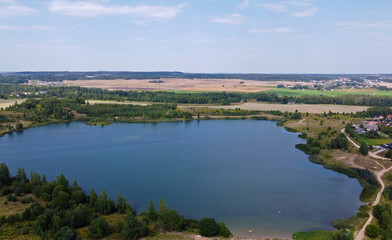 Fototapeta na wymiar Aerial view of a beautiful suburban lake in an expensive elite neighborhood